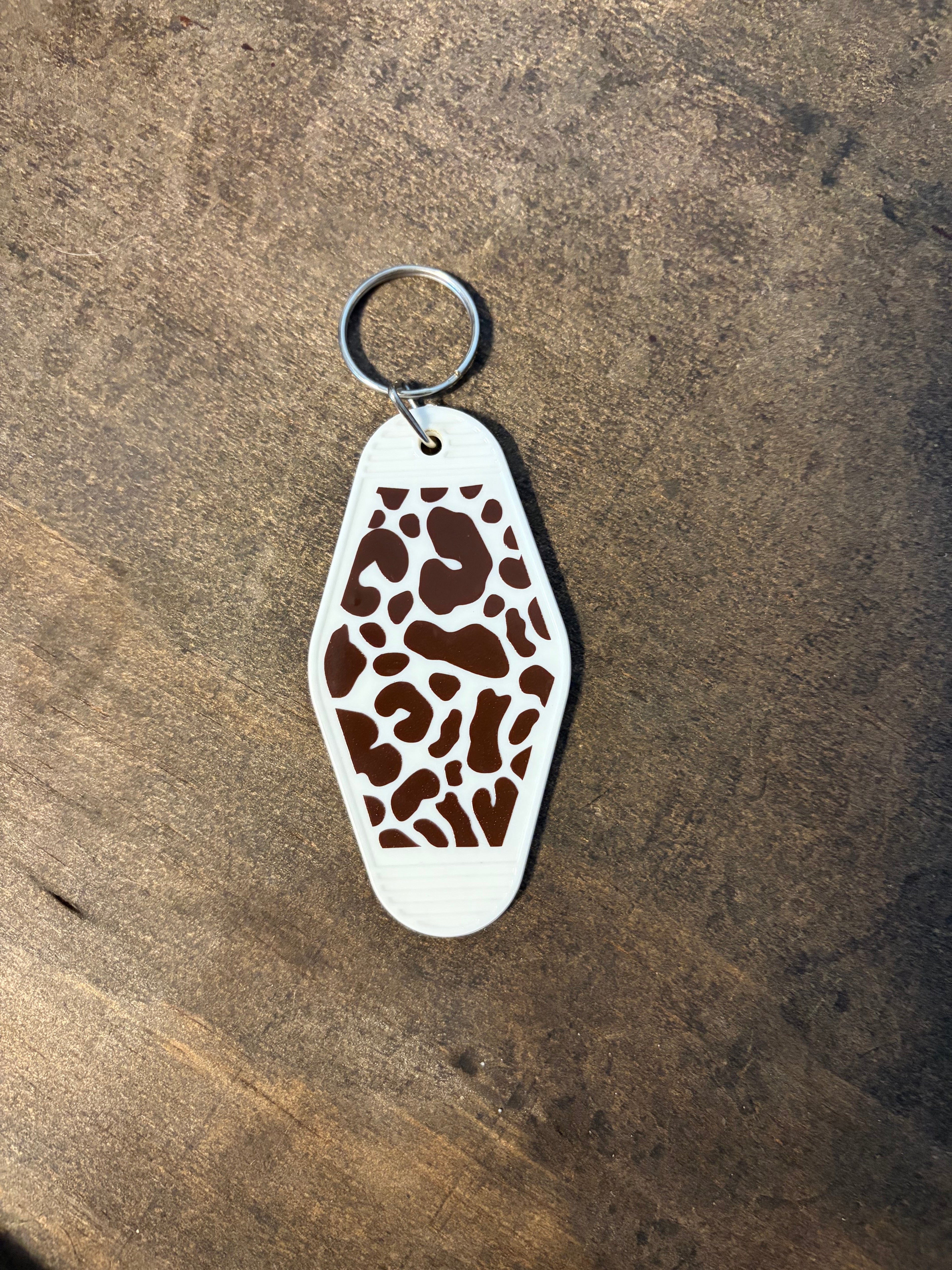 Cow Print Motel Keychain